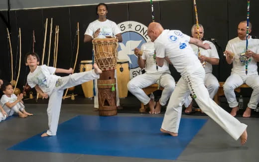 a group of people in karate uniforms