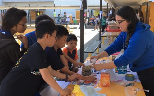 a group of people sitting at a table