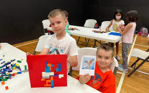 a few children sitting at a table