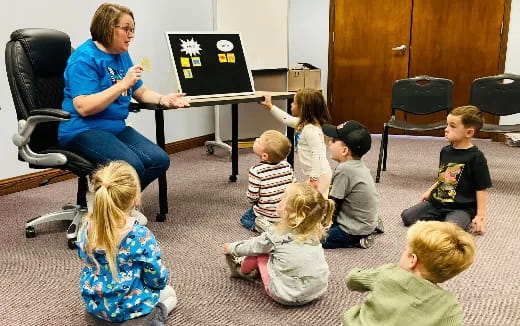 a person teaching children