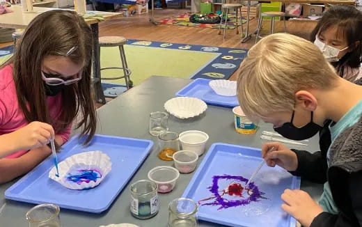 a group of children painting