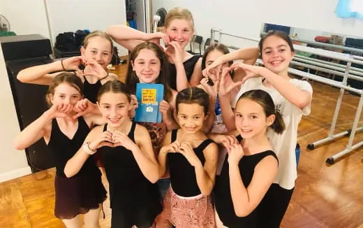 a group of girls posing for a photo