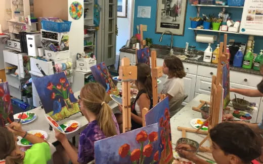 a group of children painting