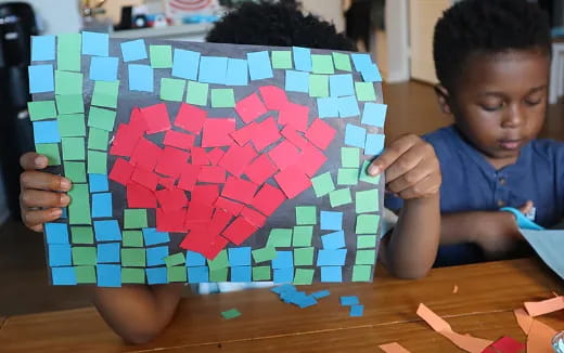 a child holding a puzzle