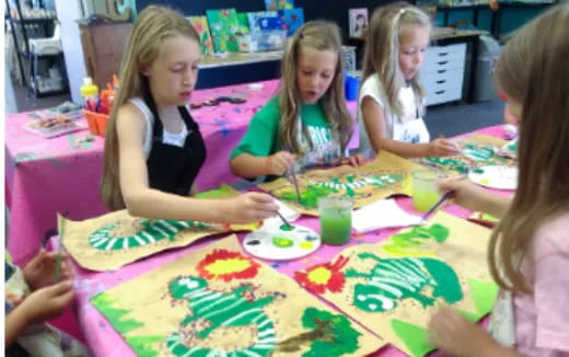 a group of children painting