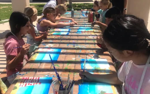 a group of children painting
