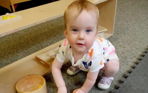 a baby sitting on a chair