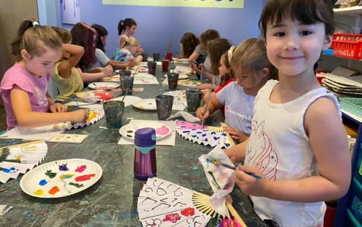 a group of children sitting at a table