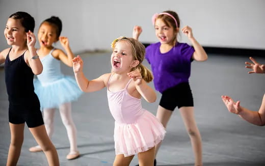 a group of children dancing