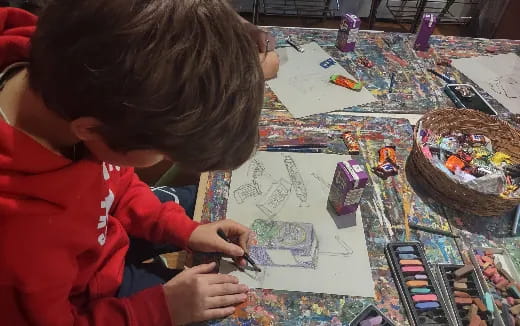 a child drawing on a paper