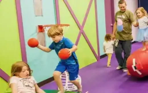 a boy playing with balls