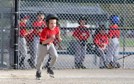 a young boy playing baseball