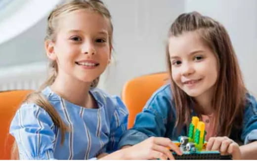 a couple of girls smiling