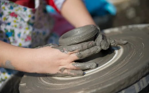 a person washing hands in a sink