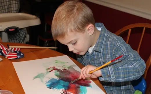 a young boy painting