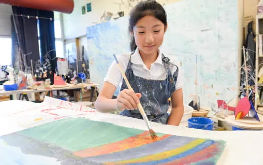 a young girl painting