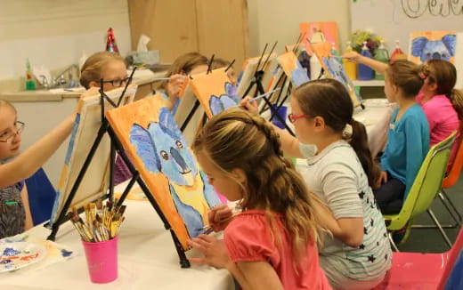 a group of children painting
