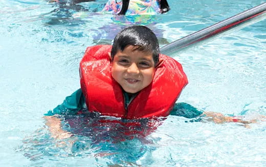 a boy in a pool