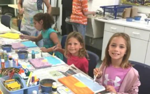 a group of children painting