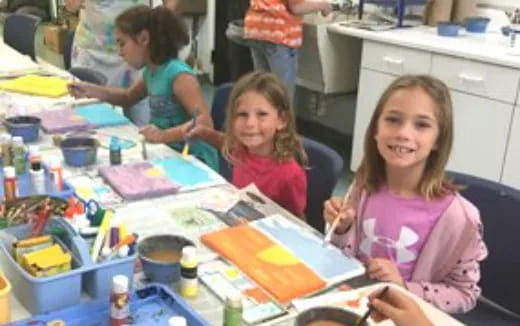 a group of children painting