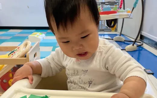 a baby sitting on a table