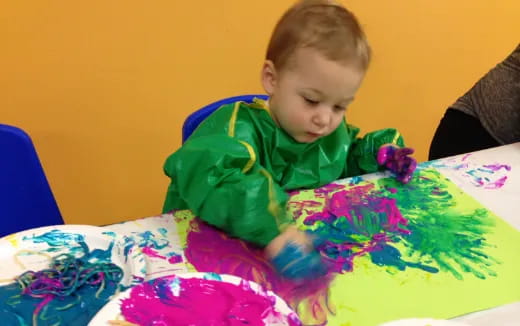 a child sitting at a table