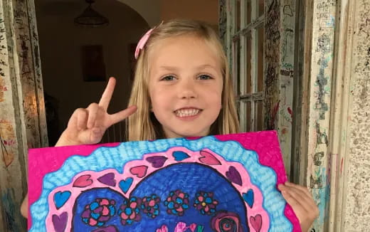 a girl holding a plate