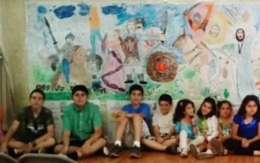 a group of people sitting on the floor