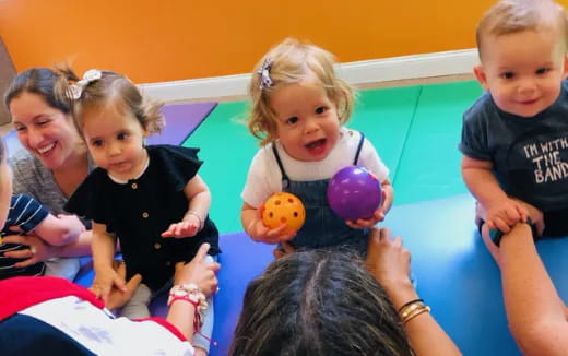 a group of children holding toys