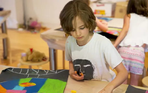 a young girl painting