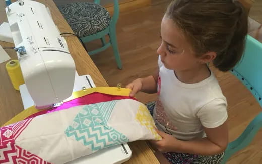 a baby painting on a table
