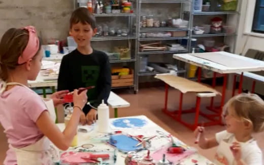 a group of children painting