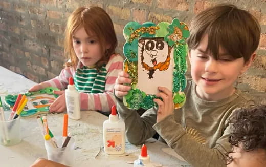 a couple of children painting