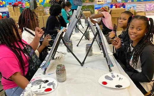 a group of people painting