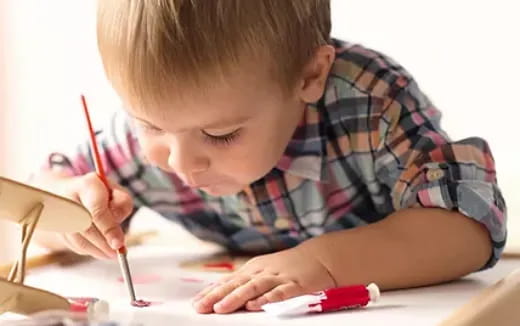 a young boy painting