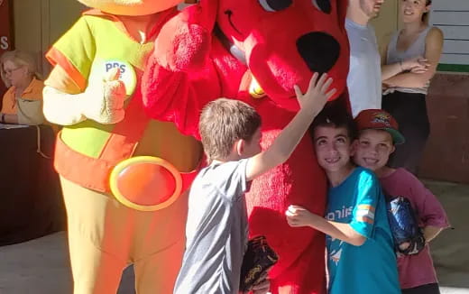 a group of kids playing with a large balloon