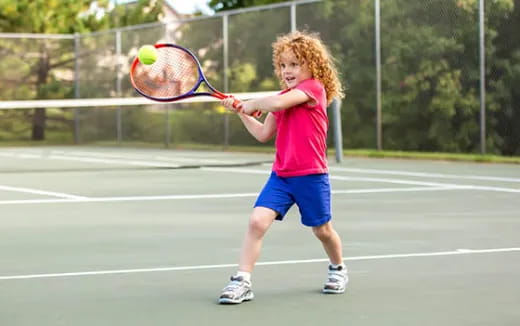a girl playing tennis