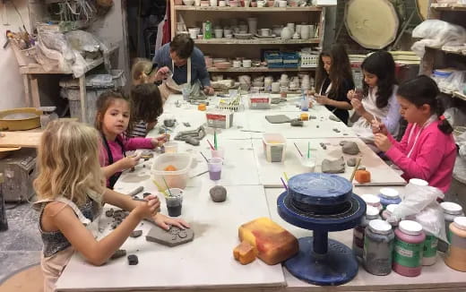 a group of children sitting at a table