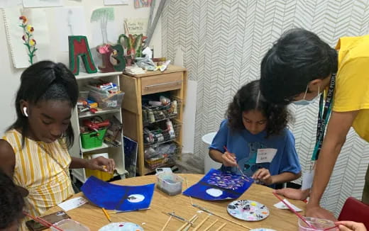 a group of children painting