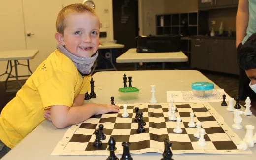 a boy playing chess