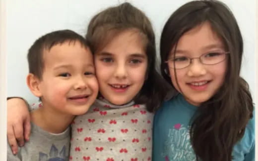 a group of children posing for a photo