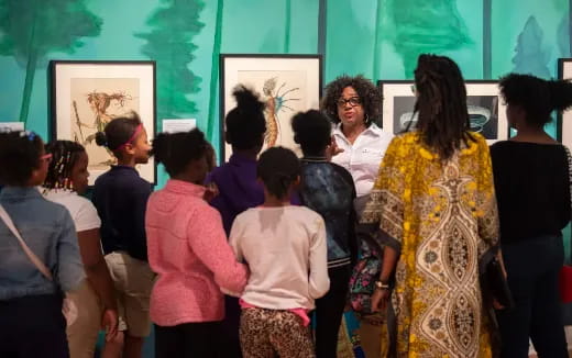 a group of people standing in a room