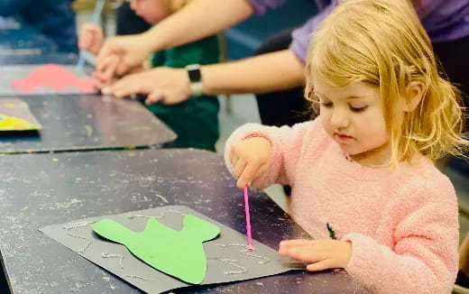 a young girl painting