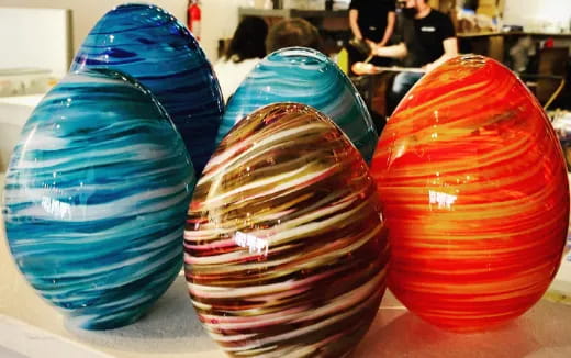 a group of colorful vases