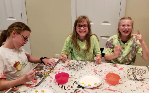 a group of women sitting at a table