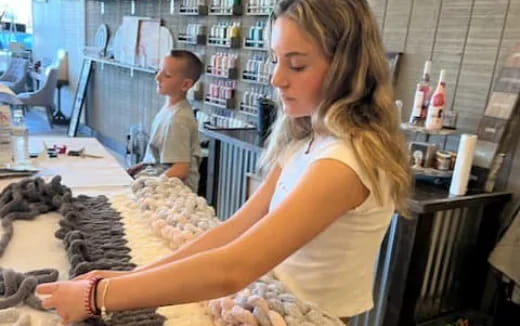 a woman working at a store