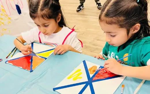 a few young girls painting