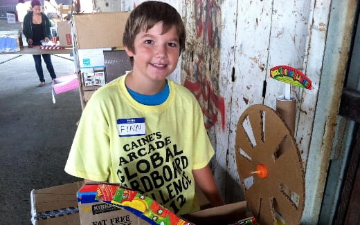 a boy holding a skateboard