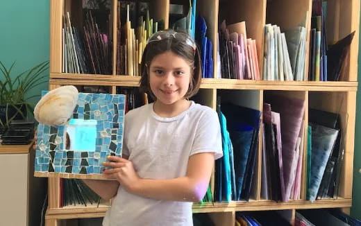 a girl holding a book