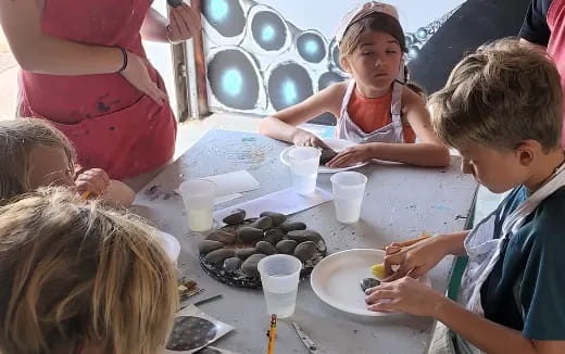 a group of children painting